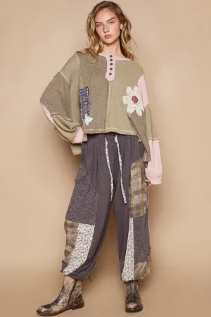 Sewn patch oversized knit top